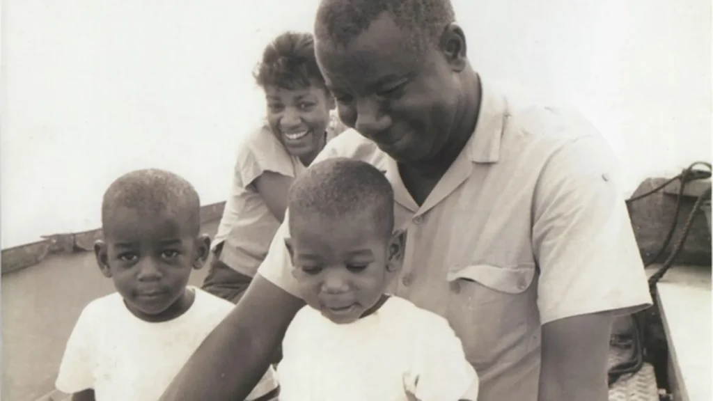 Remi as a young boy with his brother, mom and father.